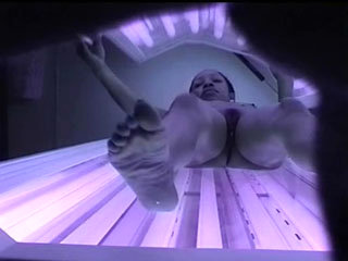 Ebony Beauty Gets Her Pussy Captured On Spy Cam While Working On Her Tan In A Solarium.